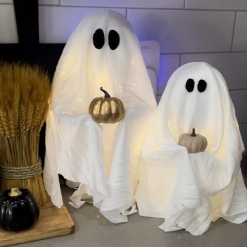 Ghosts holding pumpkins